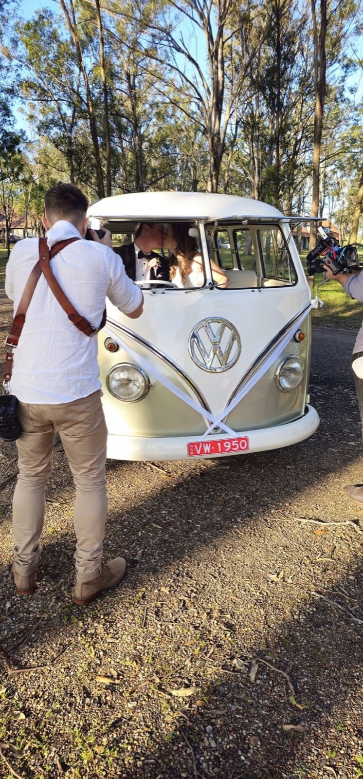 Mouse-grey split-screen VW Kombi at a wedding